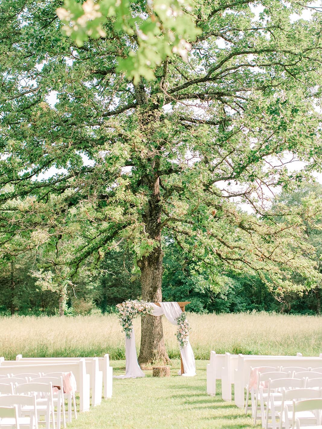outdoor wedding ceremony at rustic wedding venue