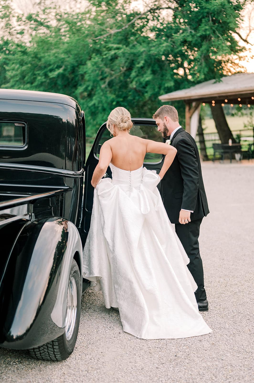groom opening car door for bride