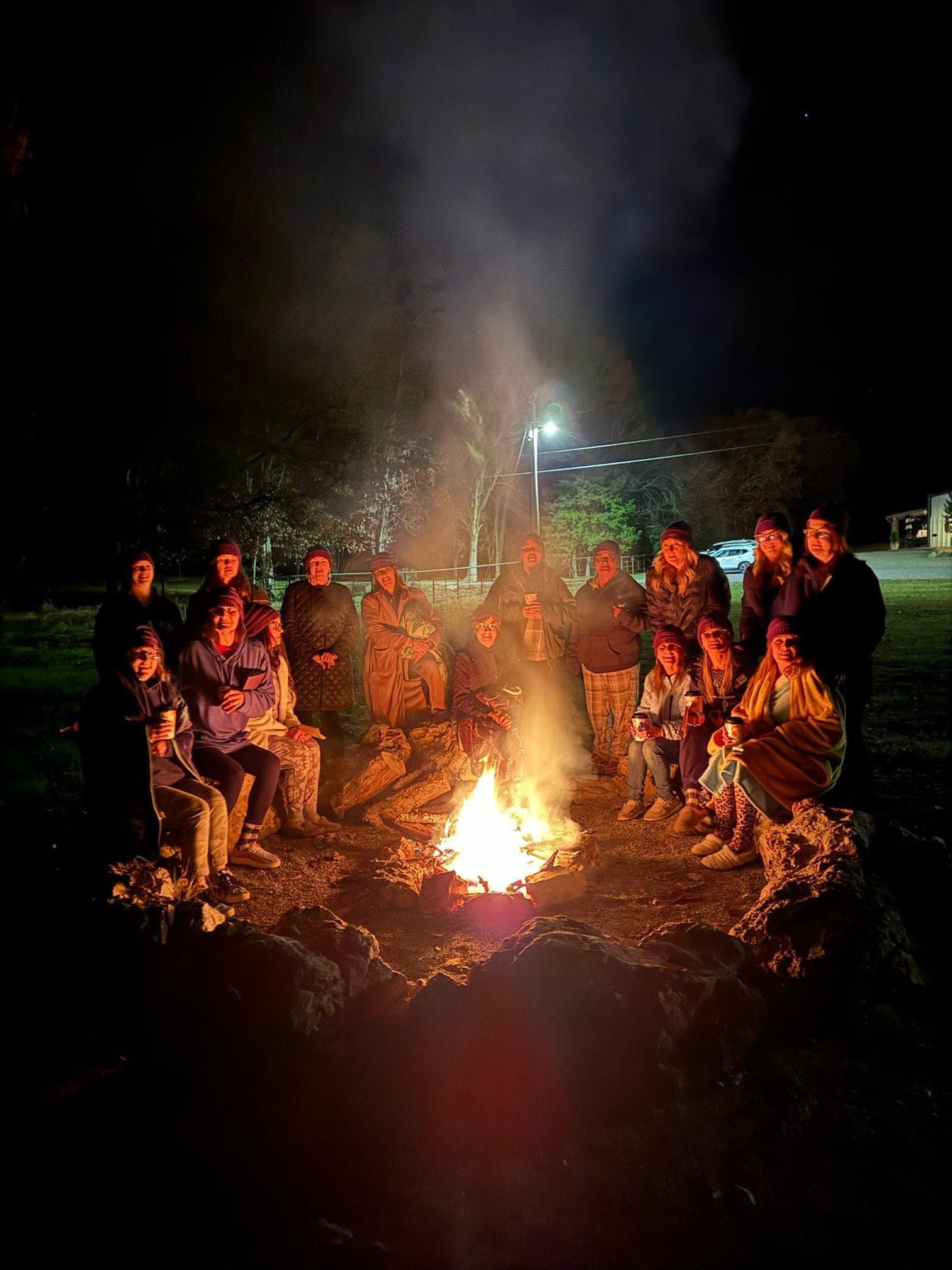 414970043_871869404945661_2545649692901710212_n group around bonfire