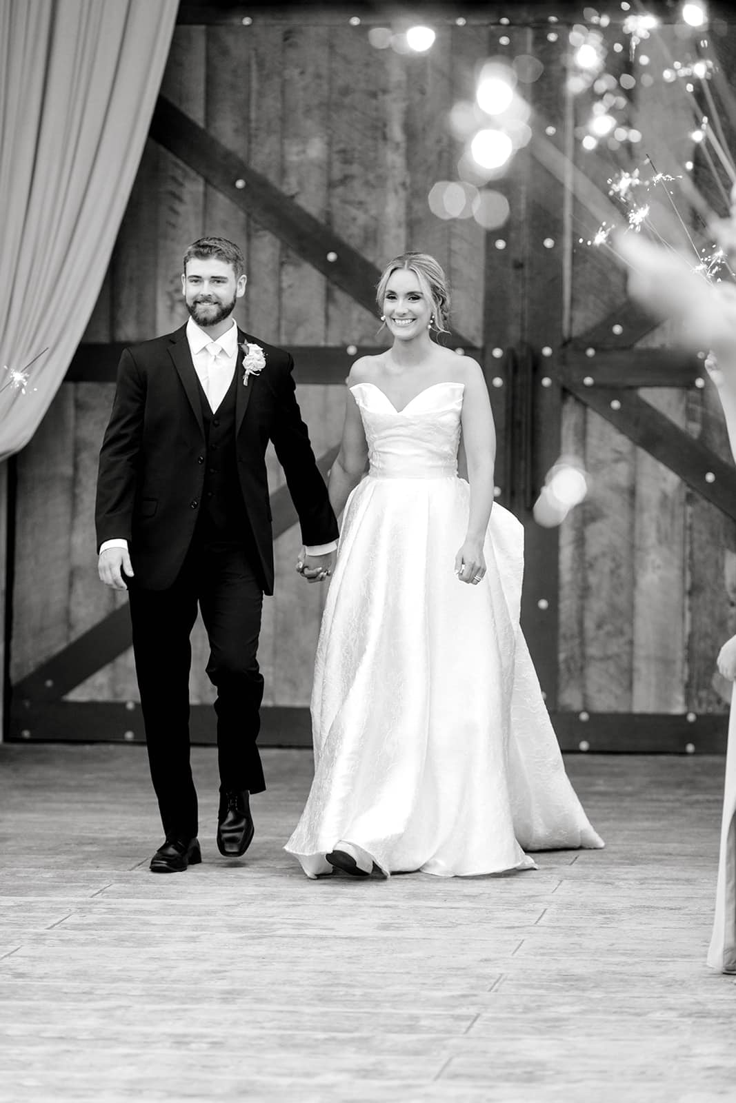 449315110_1000952552037345_7486562383624750422_n bride and groom holding hands