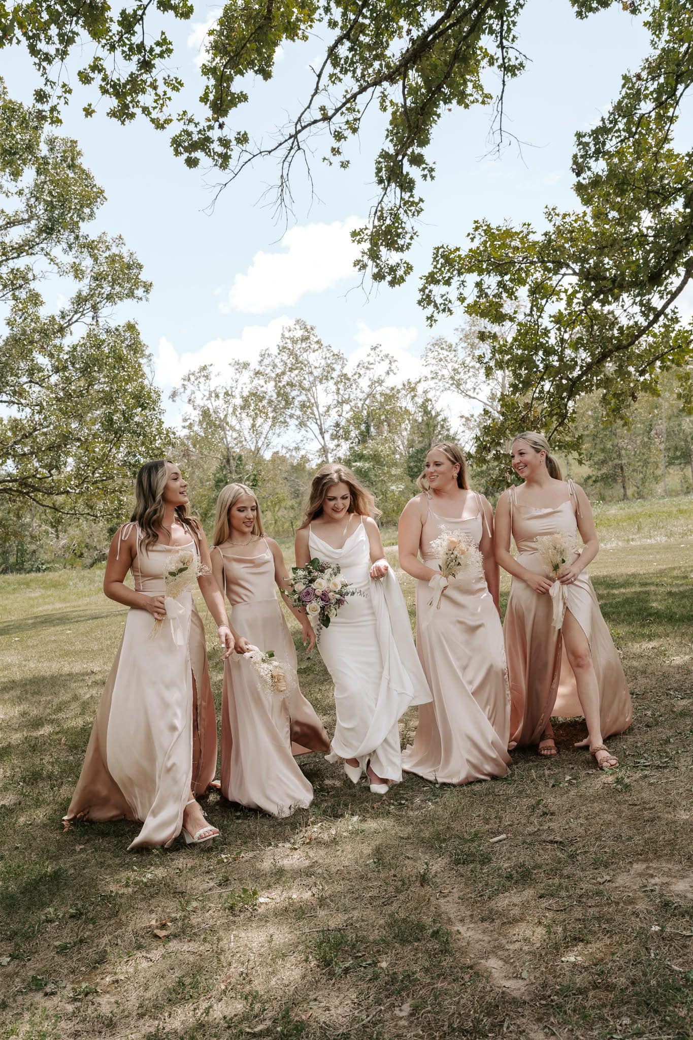 469146783_1122836966515569_2192645087042635033_n bride and bridesmaids in champagne gowns